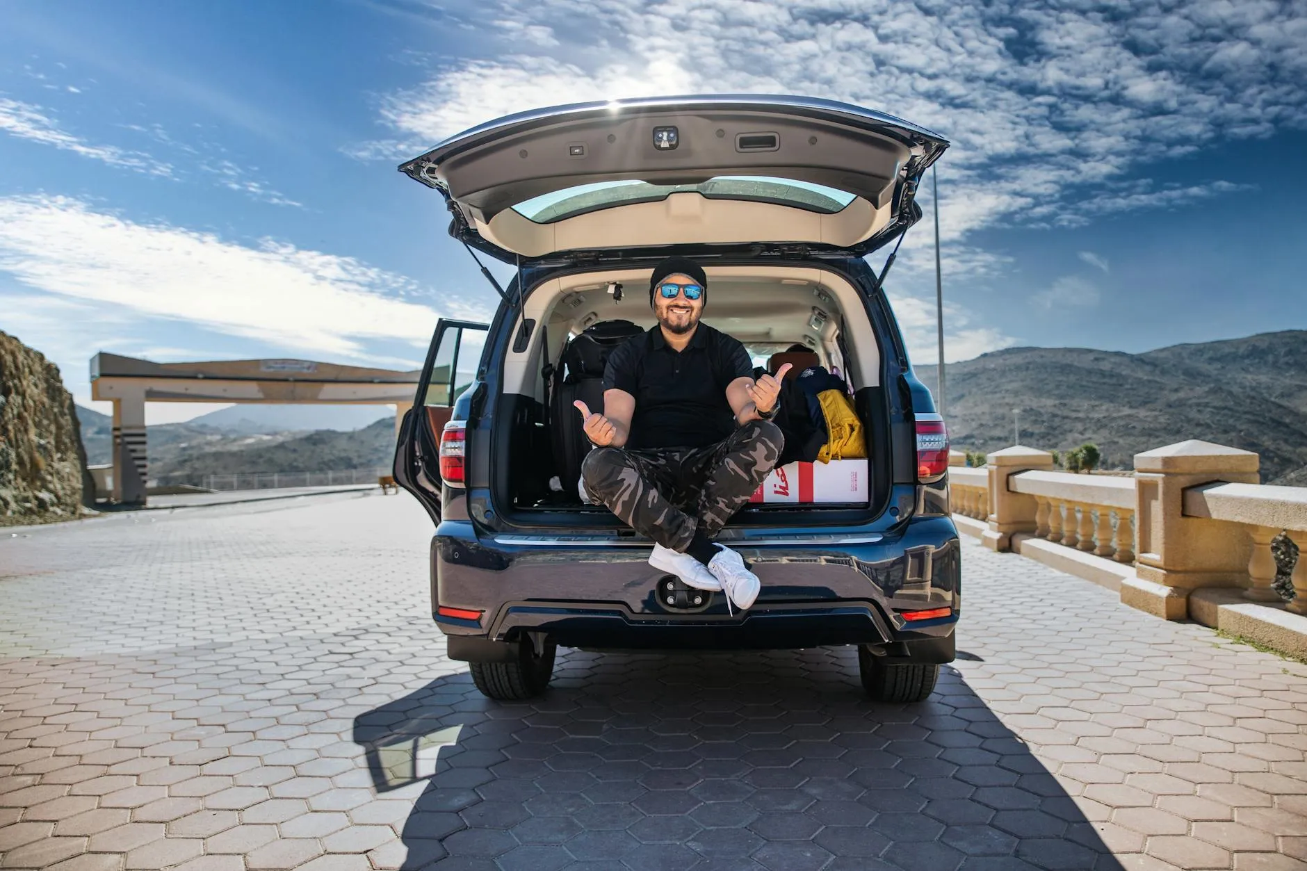 Nissan Patrol Y62 V8 SUV navigating off-road desert terrain in the UAE